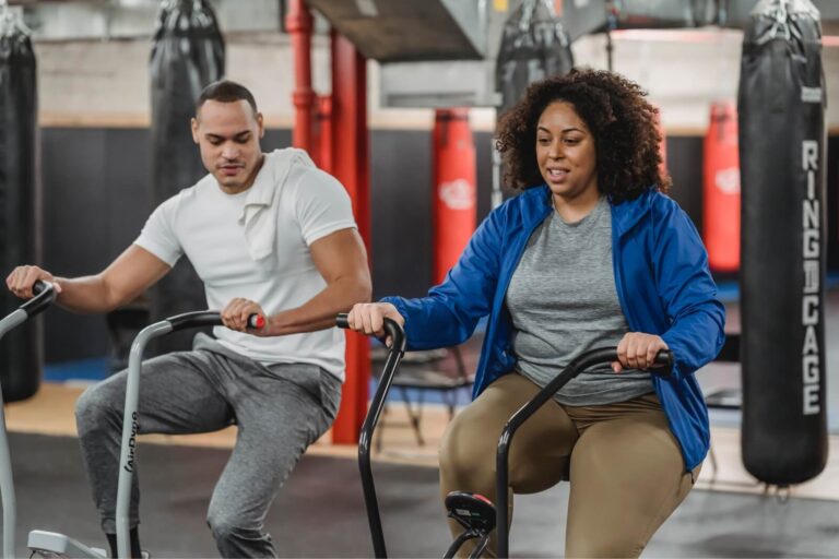 People using gym equipment