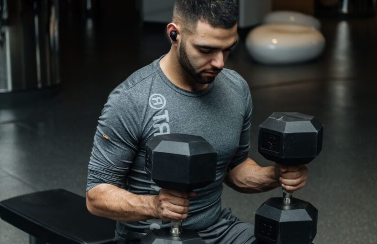 Man using dumbells